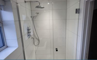 Replace a custom glass shower door in a shower cubicle located in Loughton, Essex.